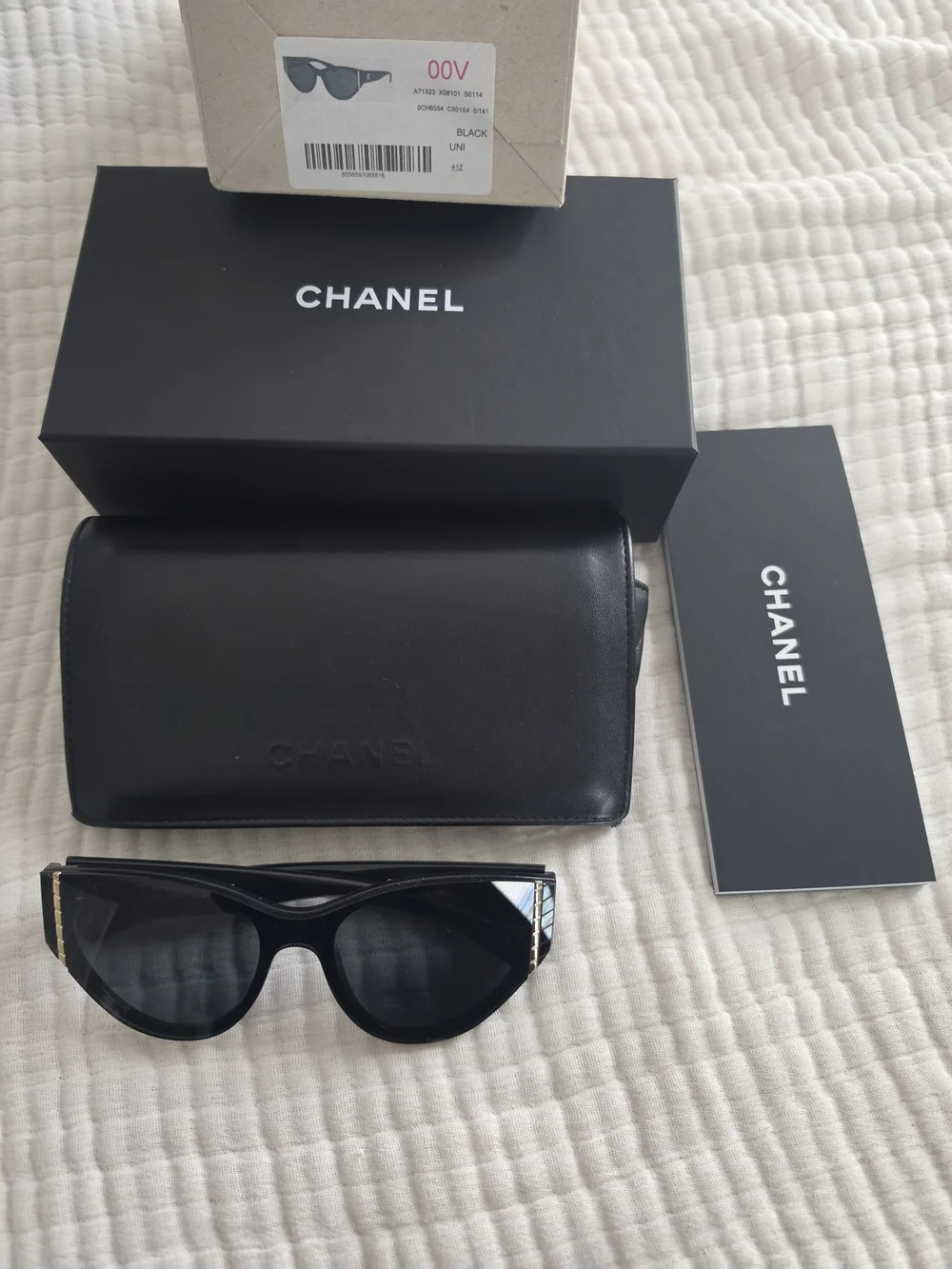 CHANEL Black Cat-Eye Sunglasses with Gold Trim